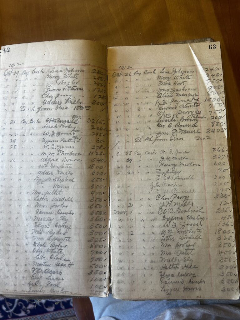 This image shows an open vintage accounting ledger filled with meticulous, handwritten entries in dark ink across pages numbered 6 and 47. The records date back to May and list various cash transactions for expenses such as stamps, laundry, and trips.