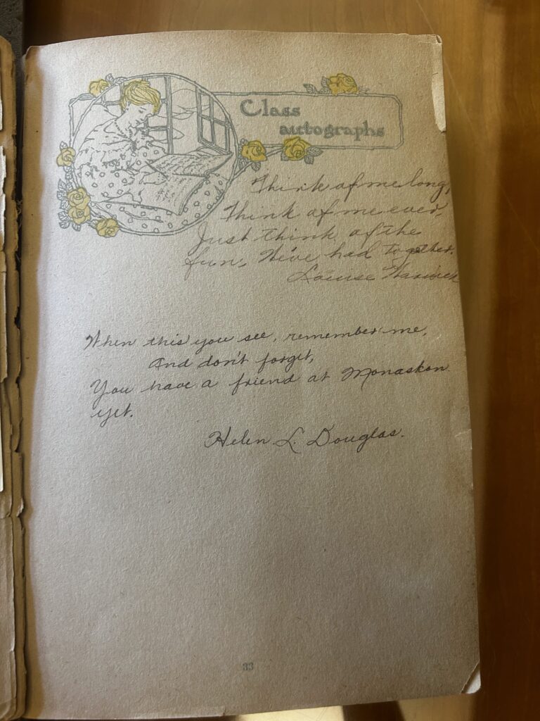 This antique "Class autographs" page features a delicate illustration of a woman writing at a desk surrounded by yellow roses. Below the heading, two heartfelt poems are handwritten in cursive, signed by Louise Hamrick and Helen L. Douglas, who remind the reader of their friendship at Monaskon.